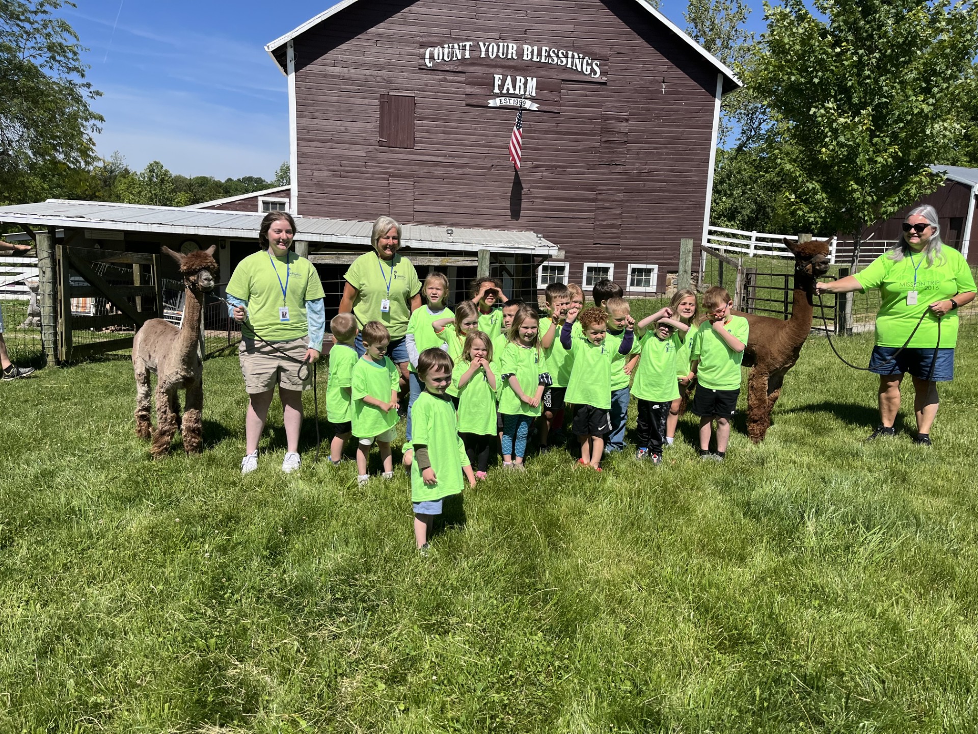 Family visiting alpacas at Count Your Blessings Farm